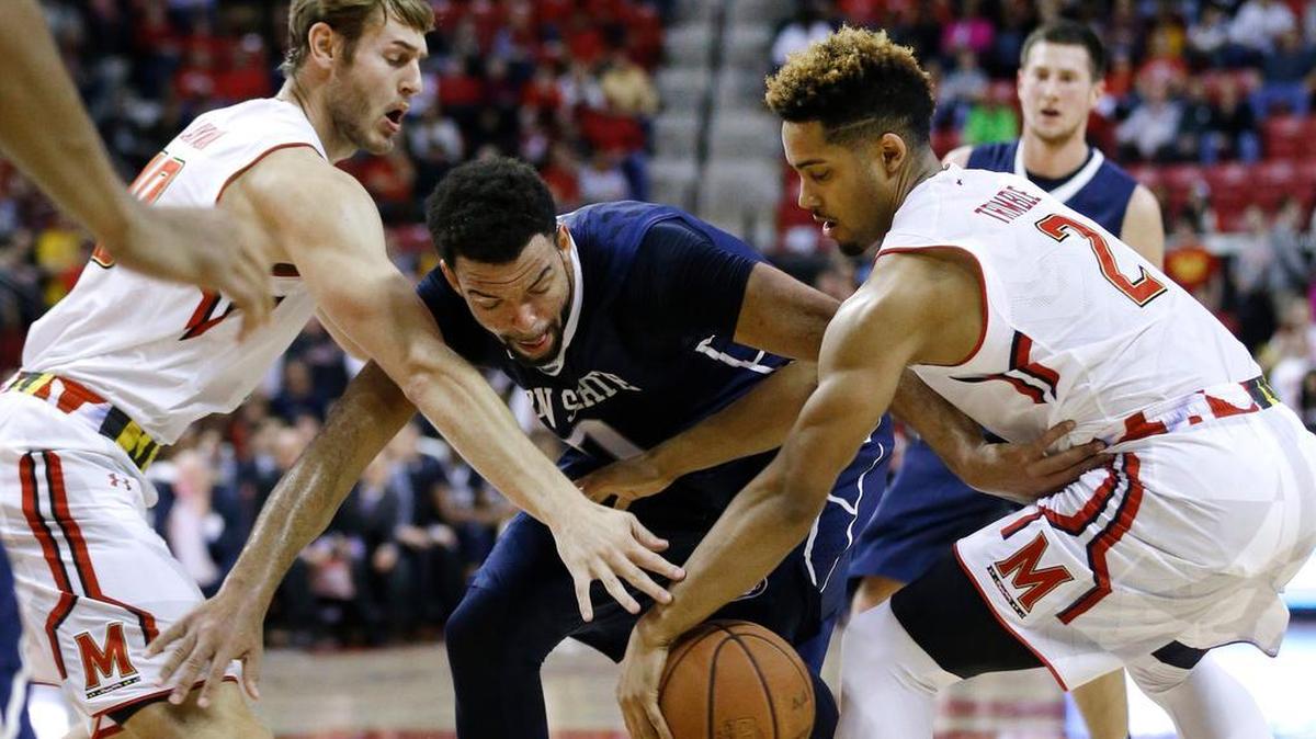 Maryland guard Melo Trimble, right, and forward Jake Layman, left, try to steal the ball from Penn State forward Payton Banks in the first half of an NCAA college basketball game, Wednesday, Dec. 30, 2015, in College Park, Md.