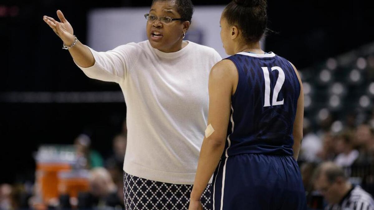Penn State coach Coquese Washington talks with Lindsey Spann during the first half of an NCAA college basketball game against Purdue at the Big Ten women's tournament Thursday, March 3, 2016, in Indianapolis. (AP Photo/Darron Cummings)