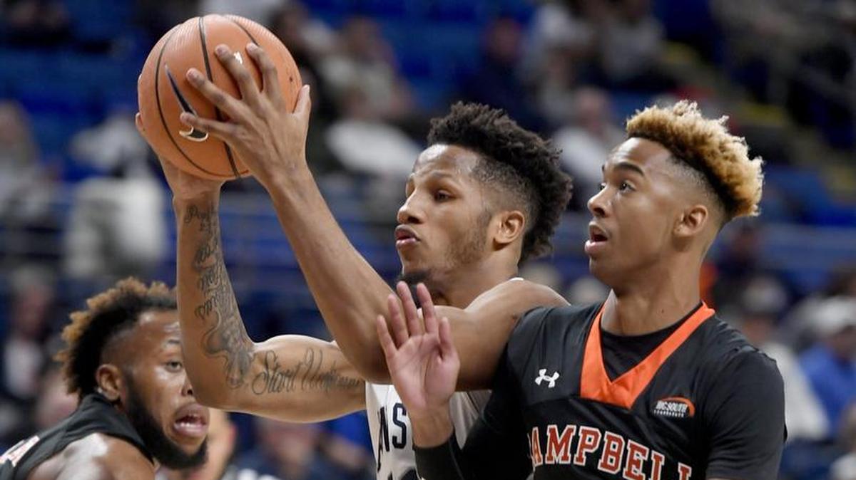 Penn State’s Lamar Stevens goes in toward the basket around Campbell’s Ja’Cor Nelson during the Friday’s game. Stevens finished Wednesday night’s contest with a team-high 25 points.