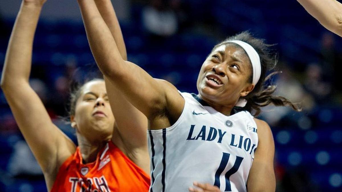 Penn State's Teniya Page shoots for a basket around Virginia Tech's Hannah Young during a December 3, 2015 women's basketball game.