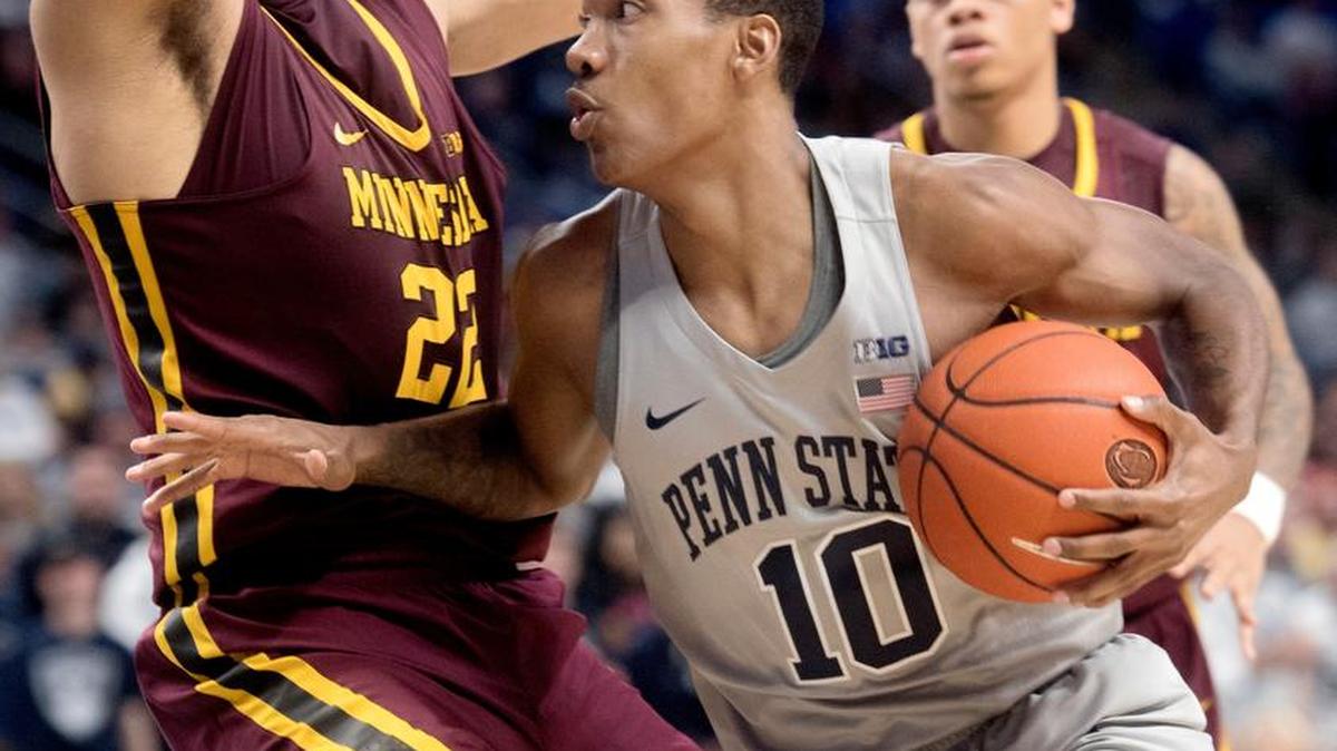 Penn State’s Tony Carr pushes around Minnesota’s Reggie Lynch during a January game at the Bryce Jordan Center.