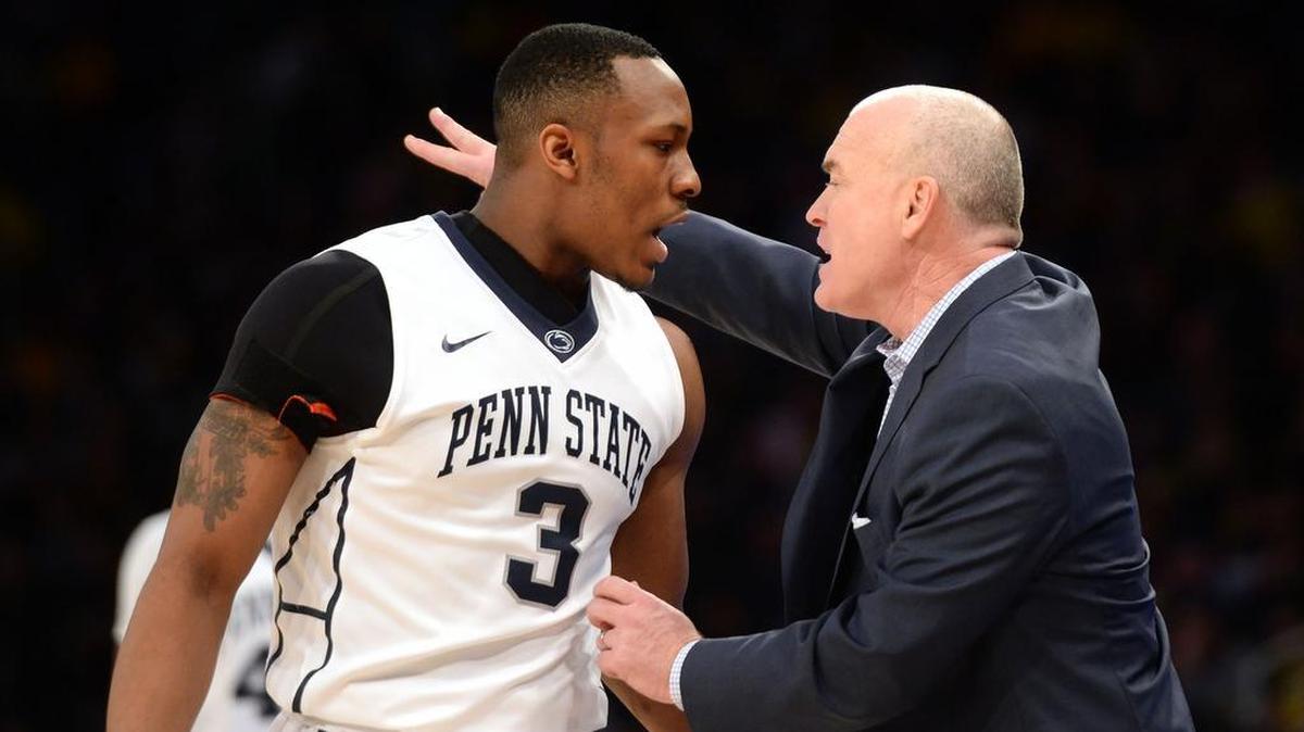 Penn State’s Devon Foster (left) and head coach Patrick Chambers have a discussion during Saturday’s game against Michigan at Madison Square Garden in New York City. Michigan defeated Penn State, 79-72.