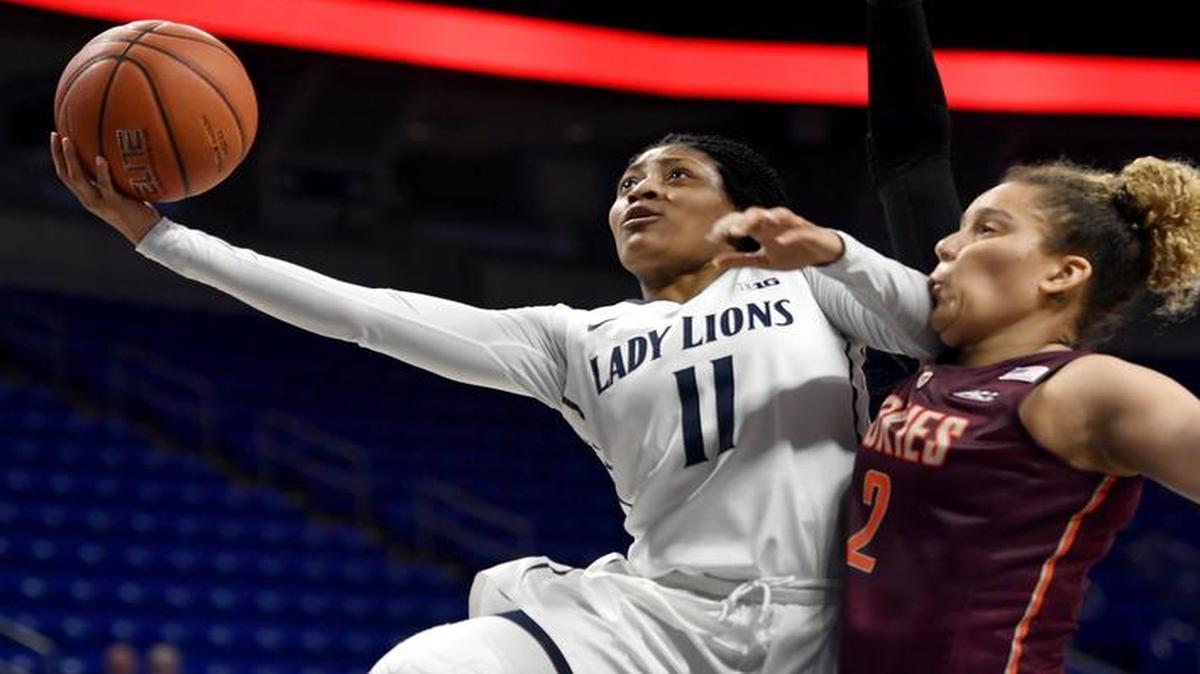 The Lady Lions’ Teniya Page makes a layup around Virginia Tech's Sidney Cook during the WNIT game on March 23. The Penn State women’s basketball team released its nonconference schedule for the upcoming season on Friday.