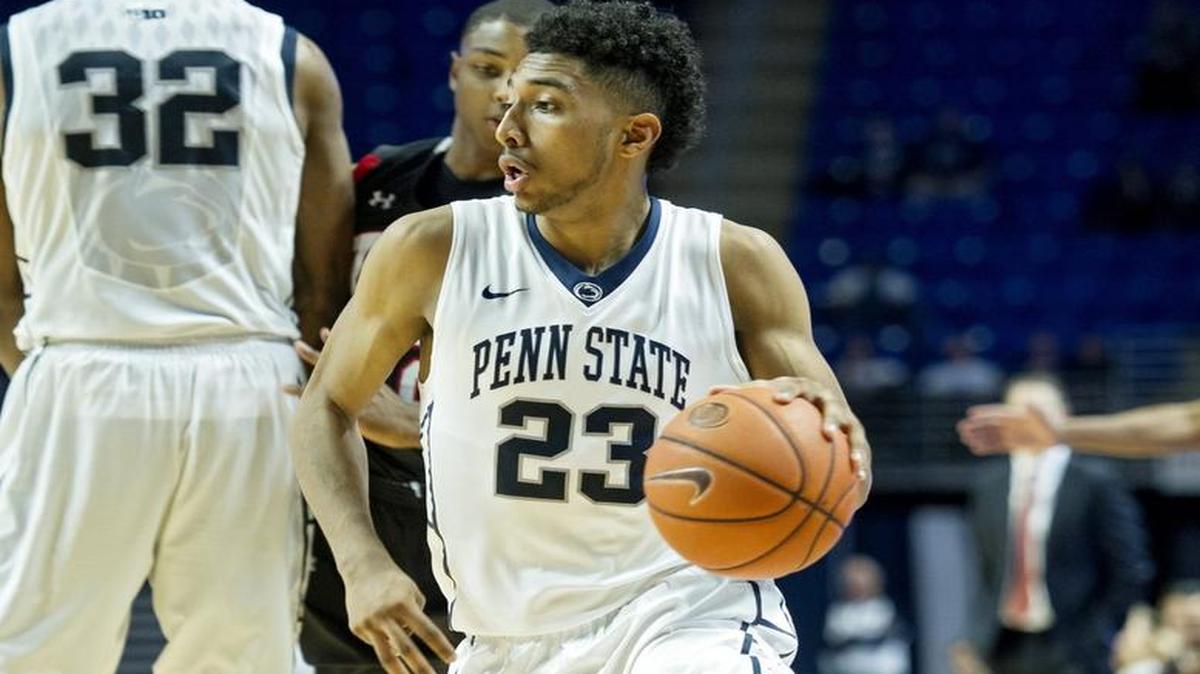 Penn State’s Josh Reaves dribbles down the court with the ball from VMI defenders during the Nov. 14 game.