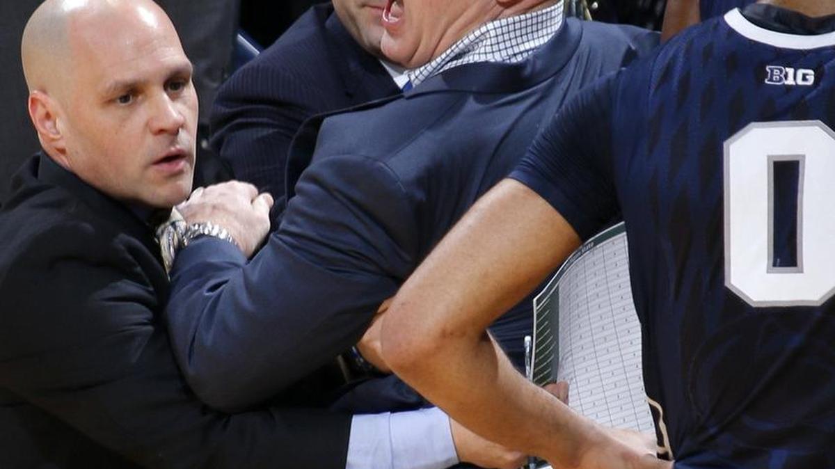 Penn State basketball coach Patrick Chambers, center, is looking past his team’s 88-57 loss to No. 2 Michigan State Sunday, and his ejection from the game, to Thursday’s matchup with Northwestern.
