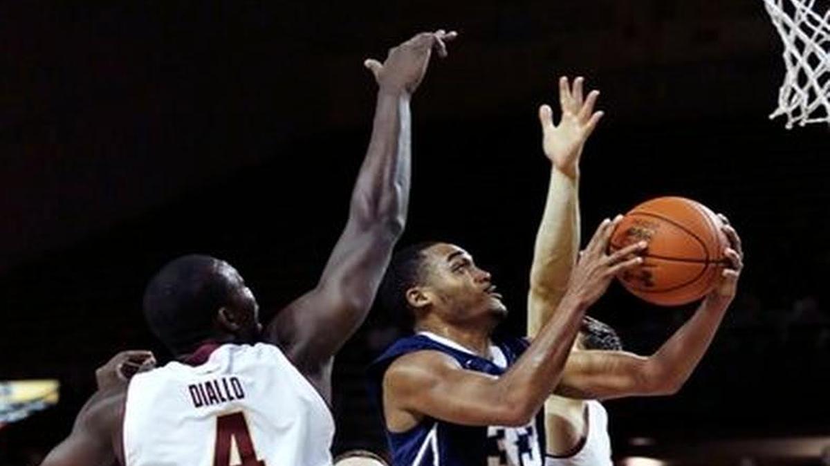 Penn State guard Shep Garner (33) drives past Boston College forward Idy Diallo (4) during the first half of an NCAA college basketball game in Boston Wednesday.