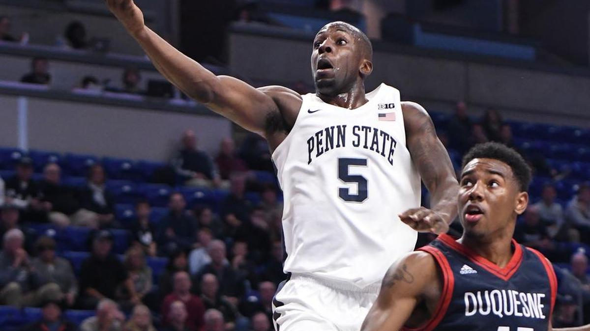Penn State’s Terrence Samuel drives to the basket for a layup as Duquesne’s Isiaha Mike defends during Sunday’s game at the Bryce Jordan Center in State College.