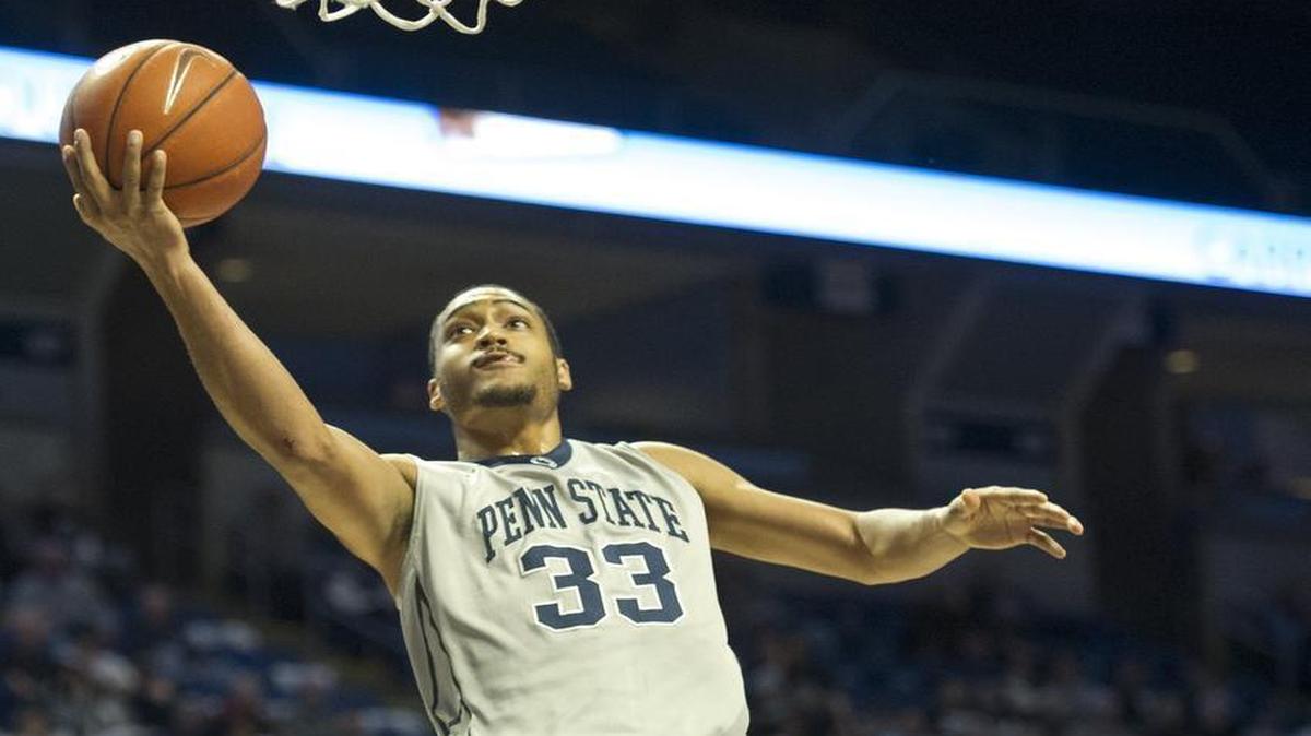 Penn State guard Shep Garner (33) jumps for a basket over Illinois guard Jaylon Tate (1) during the Nittany Lions’ 86-79 double overtime win on Sunday, March 6 at the Bryce Jordan Center.