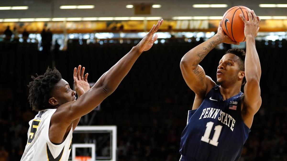 Penn State forward Lamar Stevens (11) shoots over Iowa forward Tyler Cook, left, during the first half Saturday. Stevens led the Nittany Lions with 22 points.