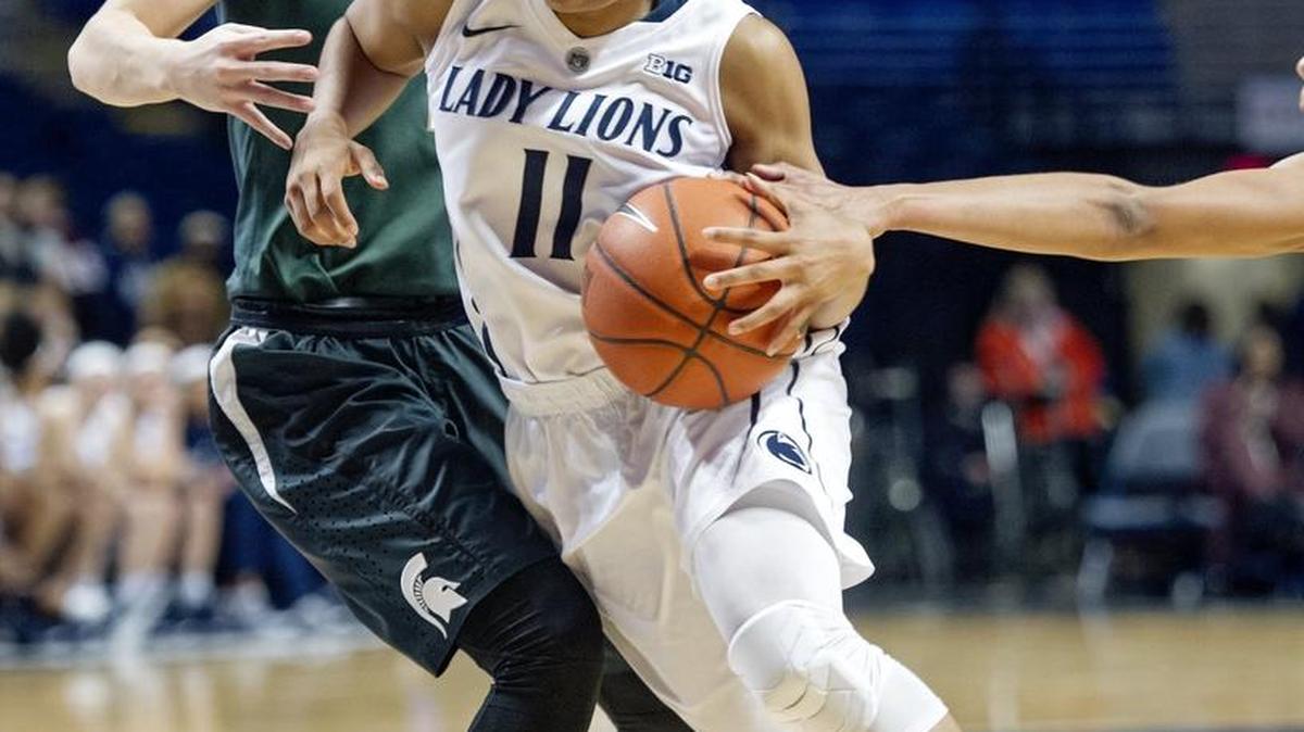 Penn State's Teniya Page dribbles around a Michigan State defender during the Thursday, January 7, 2016 game at the Bryce Jordan Center. Michigan State won, 71-55.