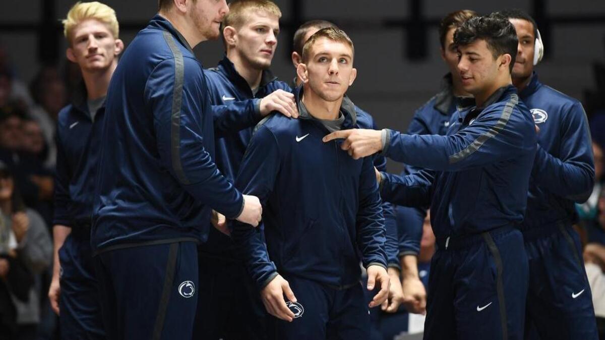 Penn State’s Zain Retherford, surrounded by his teammates, prepares to be introduced ahead of the Nittany Lions’dual against Binghamton. Retherford will be introduced for the last time at Rec Hall on Sunday for PEnn State’s senior day dual against Buffalo.