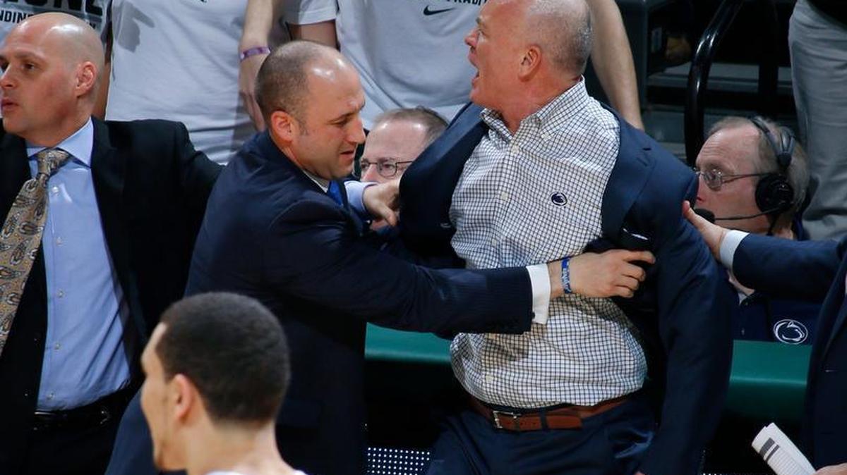 Penn State head coach Patrick Chambers, right, is restrained by associate head coach Keith Urgo before getting two technical fouls and being ejected during the first half of an NCAA college basketball game against Michigan State, Sunday, Feb. 28, 2016, in East Lansing, Mich.