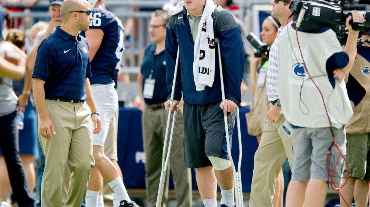 Penn State tight end Adam Breneman watches his teammates warm up from the side lines of the 2014 game against Akron at Beaver Stadium.