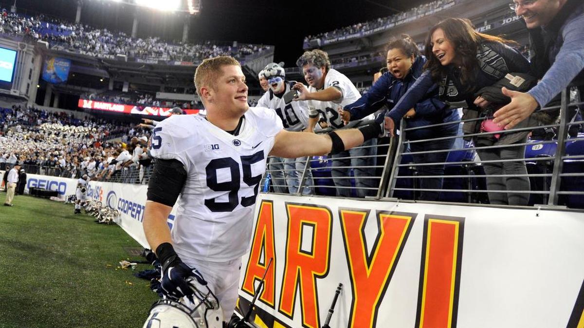 Penn State's Carl Nassib celebrates with fans after the win over Maryland at M&T Bank Stadium in Baltimore on Saturday, Oct. 24, 2015.