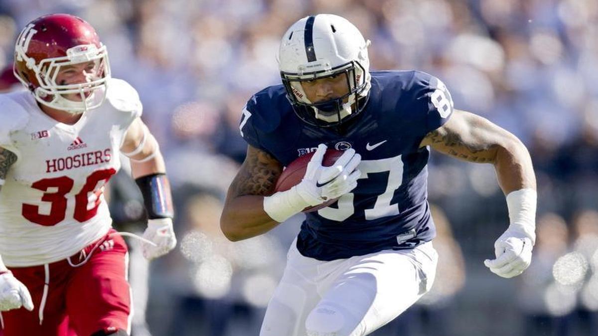 Penn State tight end Kyle Carter runs down the field with the ball from Indiana safety Chase Dutra during the Saturday, October 10, 2015 game at Beaver Stadium.