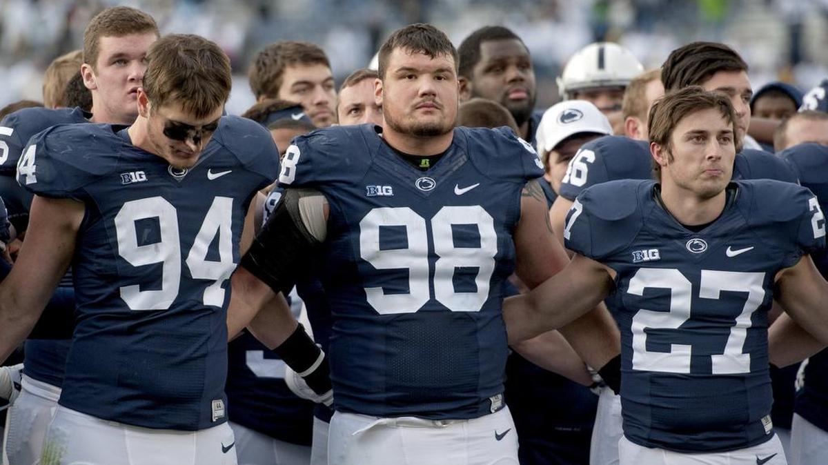 Penn State defensive tackle Anthony Zettel stands in disappointment with his teammates after the 28-16 loss to Michigan at Beaver Stadium on Saturday, November 21, 2015.