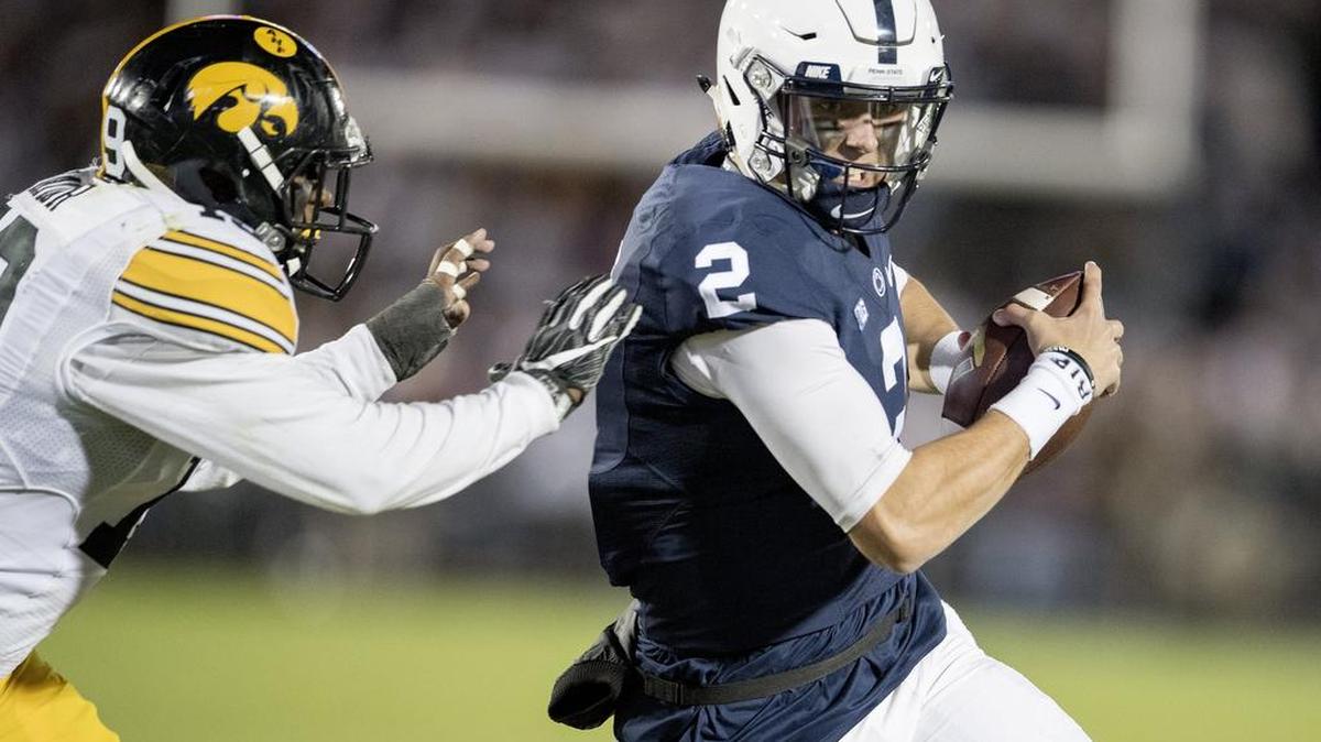 Penn State quarterback Tommy Stevens runs into the end zone for a touchdown past an Iowa defender during the Saturday, November 5, 2016 game at Beaver Stadium. Penn State won, 41-14.