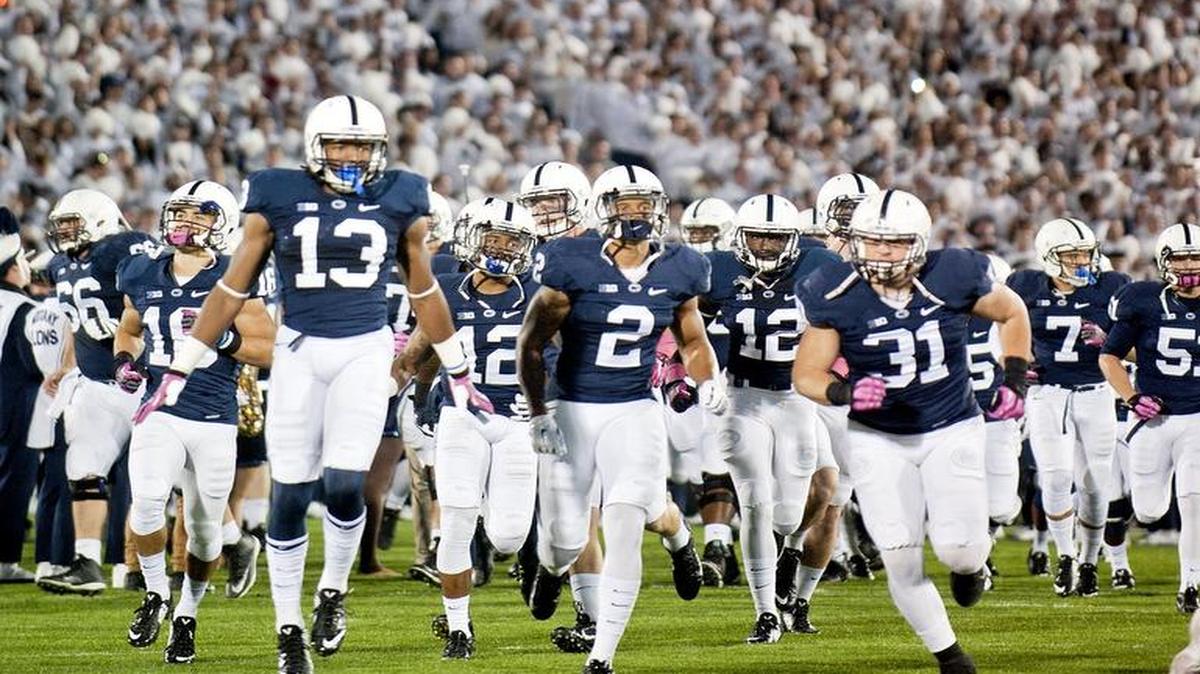 The crowd cheers on Penn State as players take the field for the 2014 White Out game against Ohio State at Beaver Stadium.