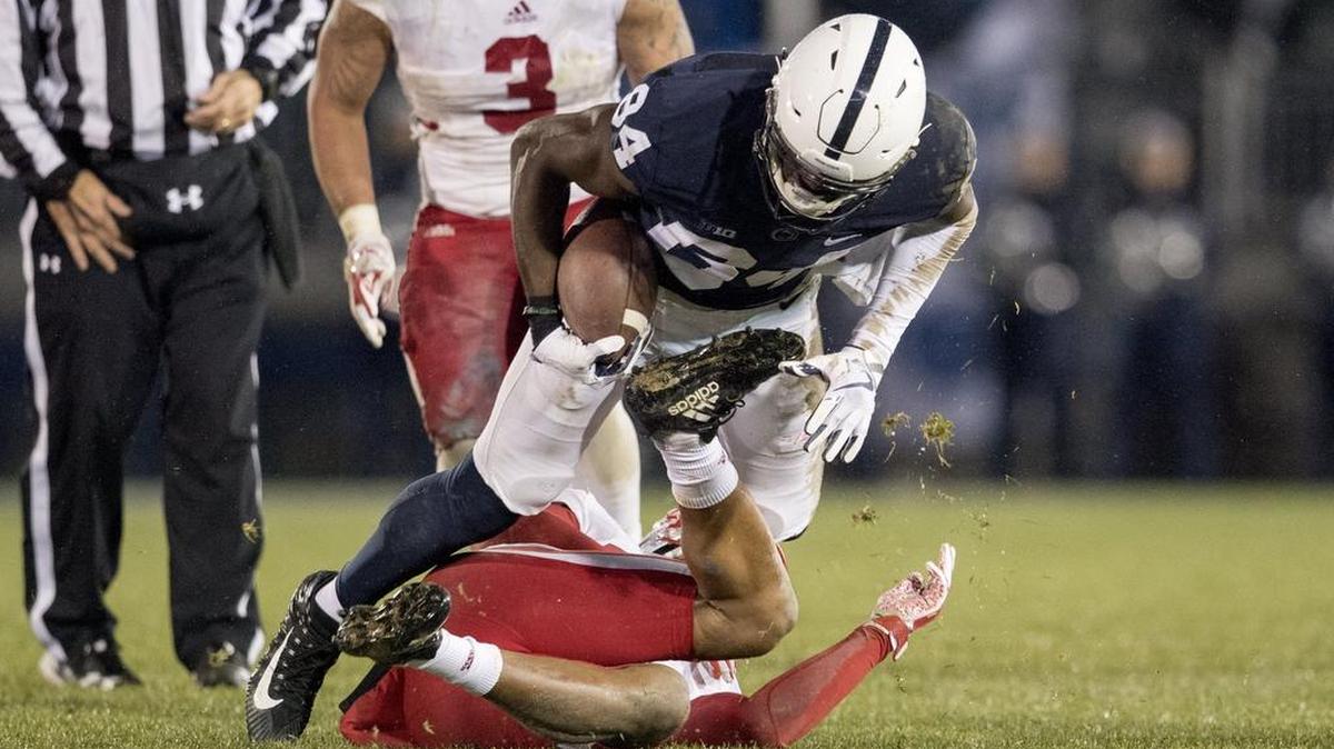 Penn State wide receiver Juwan Johnson gets tripped up by a Nebraska defender during the game Saturday.
