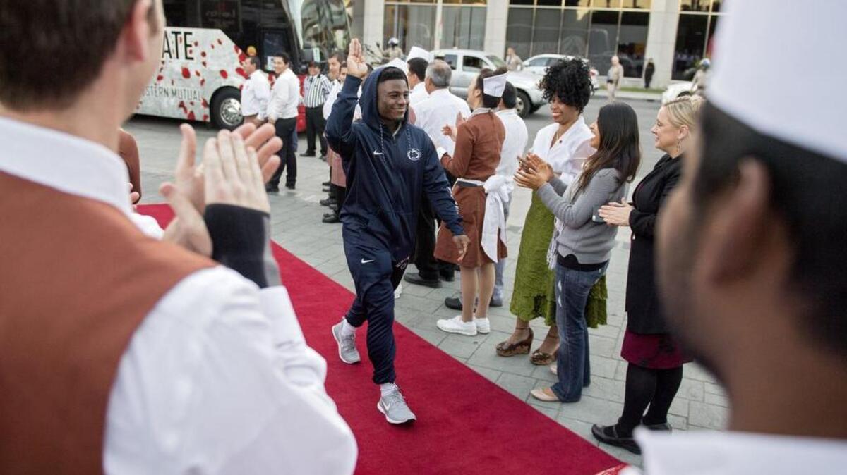 Penn State running back Mark Allen waves to the servers as they cheer for the team’s arrival at Lawry’s for the Rose Bowl tradition on Wednesday, December 28, 2016. Players, coaches and staff enjoyed a prime rib meal.