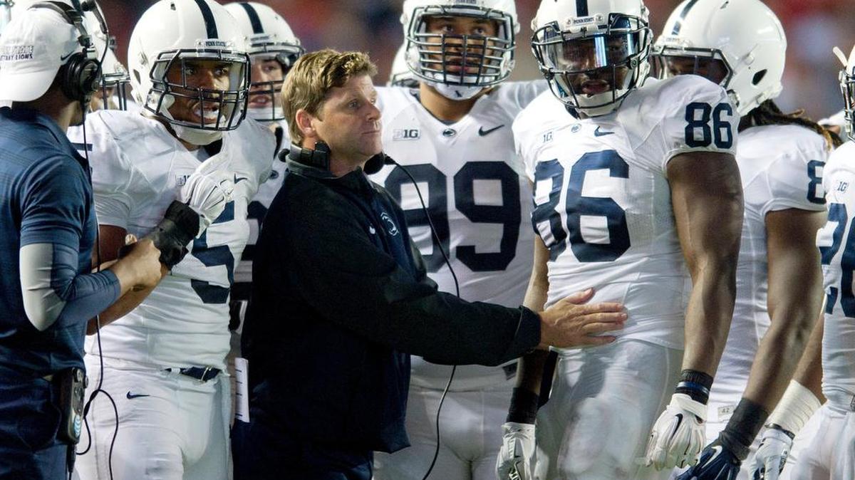Penn State coach Brent Pry talks to the players during the Saturday, September 13, 2014 game against Rutgers at High Point Solutions Stadium.