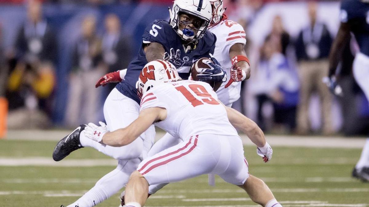 Penn State wide receiver DaeSean Hamilton makes a catch and runs past Wisconsin safety Leo Musso for a first down during the Big Ten Championship game on Saturday, December 3, 2016 at Lucas Oil Stadium.