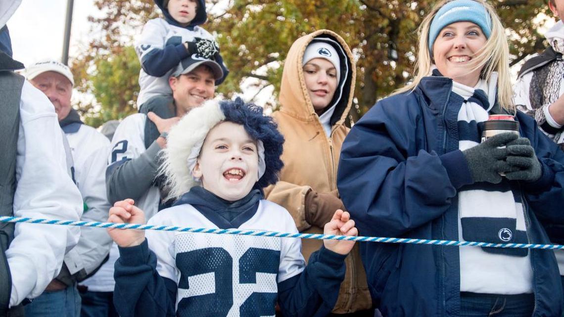 Evan Mellace, 11, cheers as he waits for the team to arrive for the Penn State football came against Ohio State on Saturday, October 22, 2016. Mellace, who is from Pine Grove Mills has been coming to Penn State games for years and has been through all types of weather.