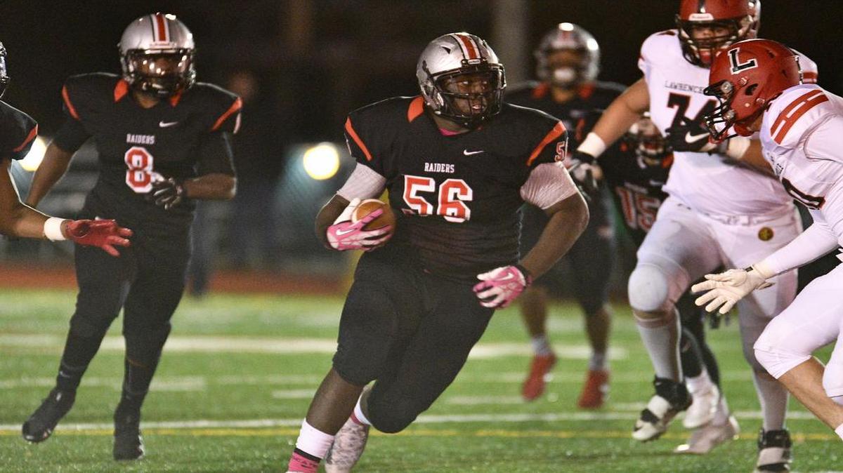 Defensive tackle Fred Hansard, an incoming Penn State freshman, picks up the ball during The Hun School’s game against Lawrenceville on Oct. 22, 2016. Hansard was rated as the nation’s No. 137 prospect by Rivals and No. 143 prospect by ESPN.