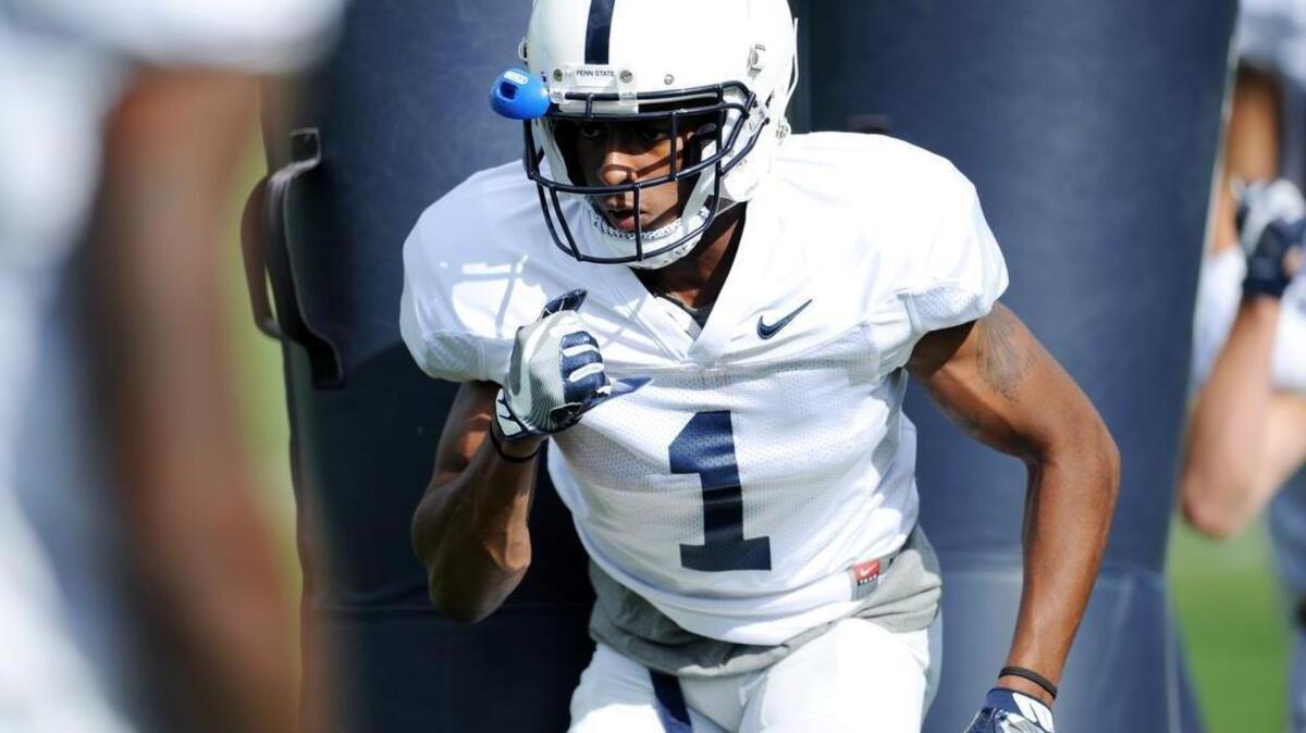 Penn State wide receiver KJ Hamler runs a drill during practice on the outdoor fields at Lasch.