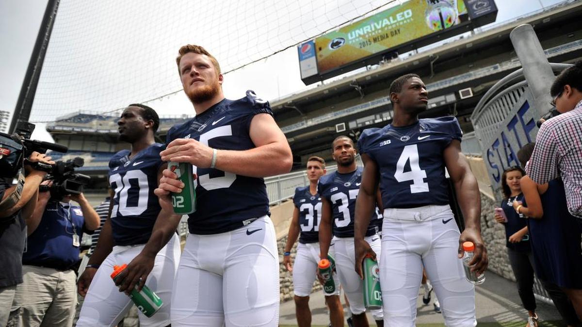Former State College Area High School player and current Penn State linebacker Matthew Baney walks onto the field for media day. The Penn State University football team hosted media day at Beaver Stadium Thursday, August 6, 2015 in University Park, Pa.
