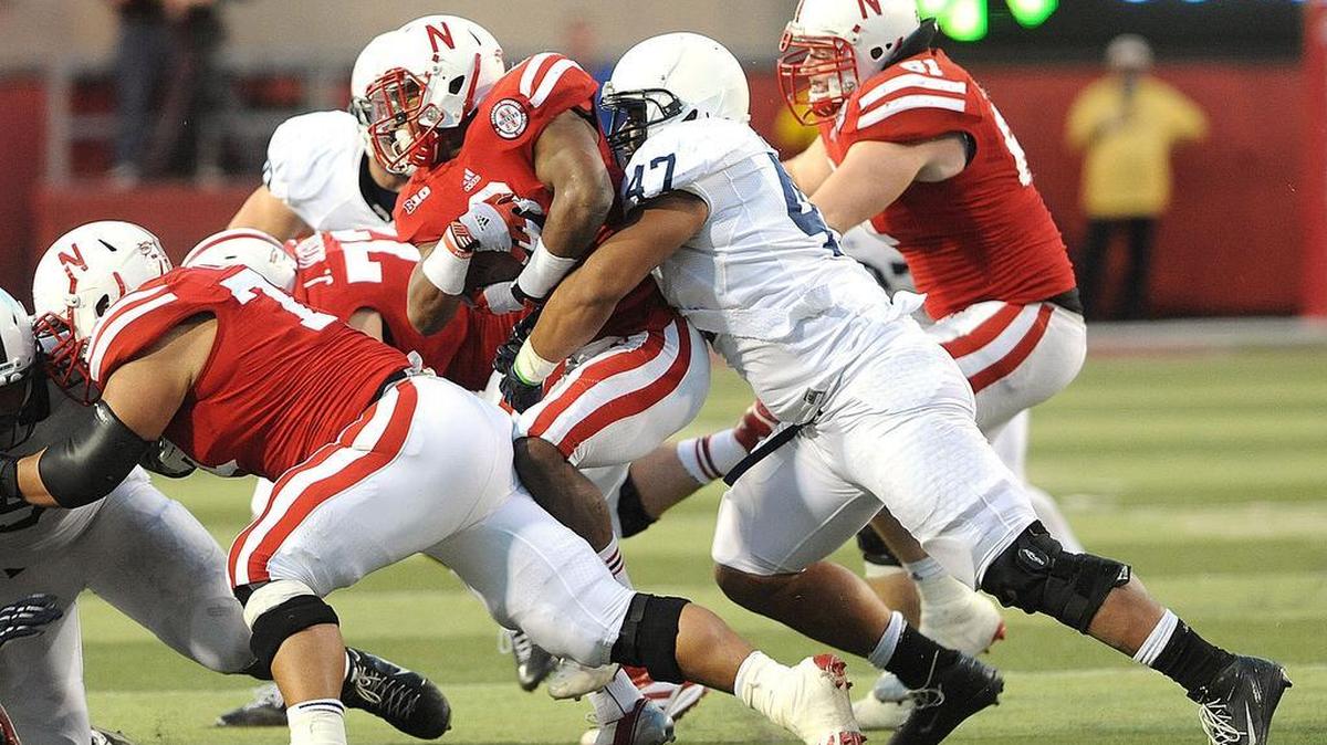 Penn State defensive end Jordan Hill (47) tackles Nebraska's Ameer Abdullah during Saturday's game at Nebraska in Lincoln, Nebraska. Nebraska defeated Penn State, 32-23.