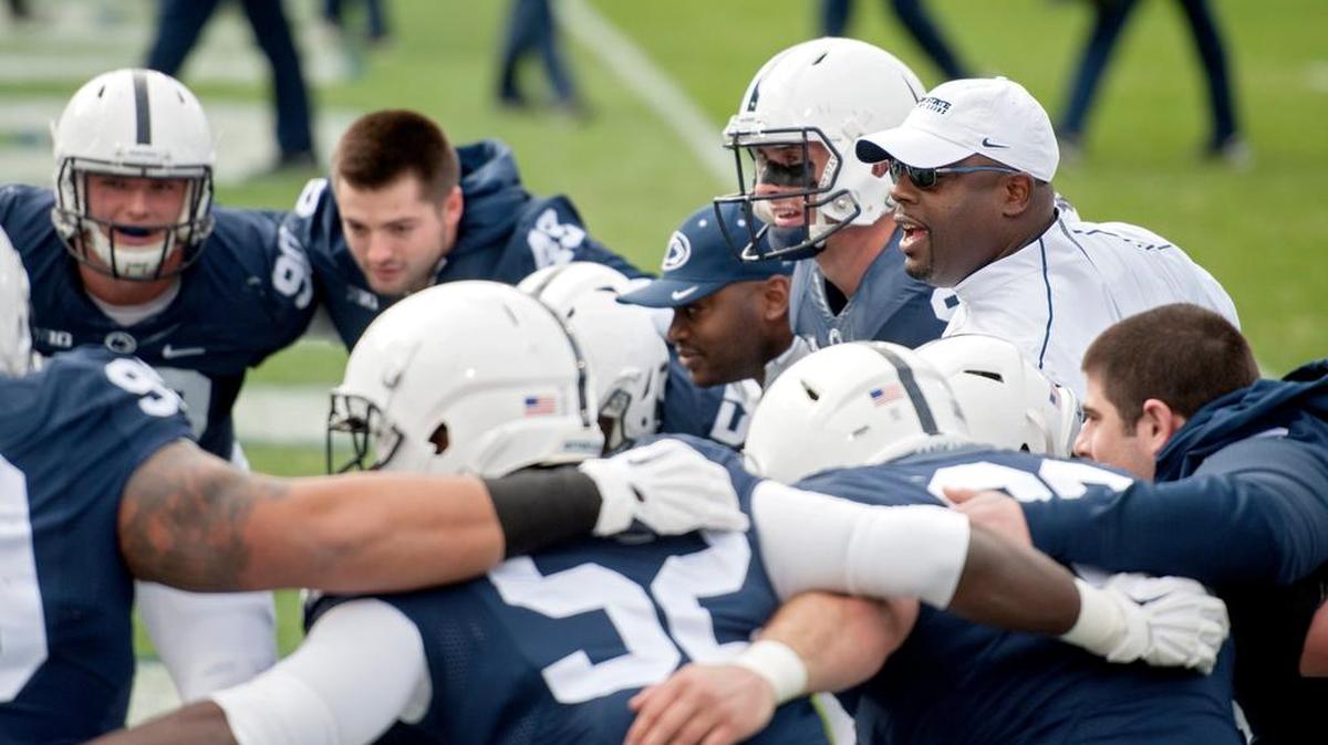 Penn State defensive line coach Sean Spencer gets amped up with his players during warmups before the Saturday, November 21, 2015 football game at Beaver Stadium.