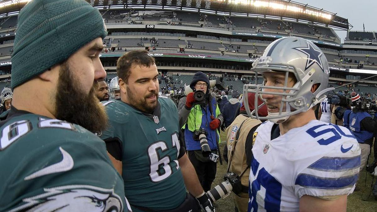 Philadelphia Eagles guard Stefen Wisniewski (61) talks to Dallas Cowboys linebacker and fellow Penn State alum Sean Lee (50), along with Eagles center Jason Kelce (62), on Dec. 31, 2017. Wisniewski and the Eagles are headed to Super Bowl LII on Feb. 4.