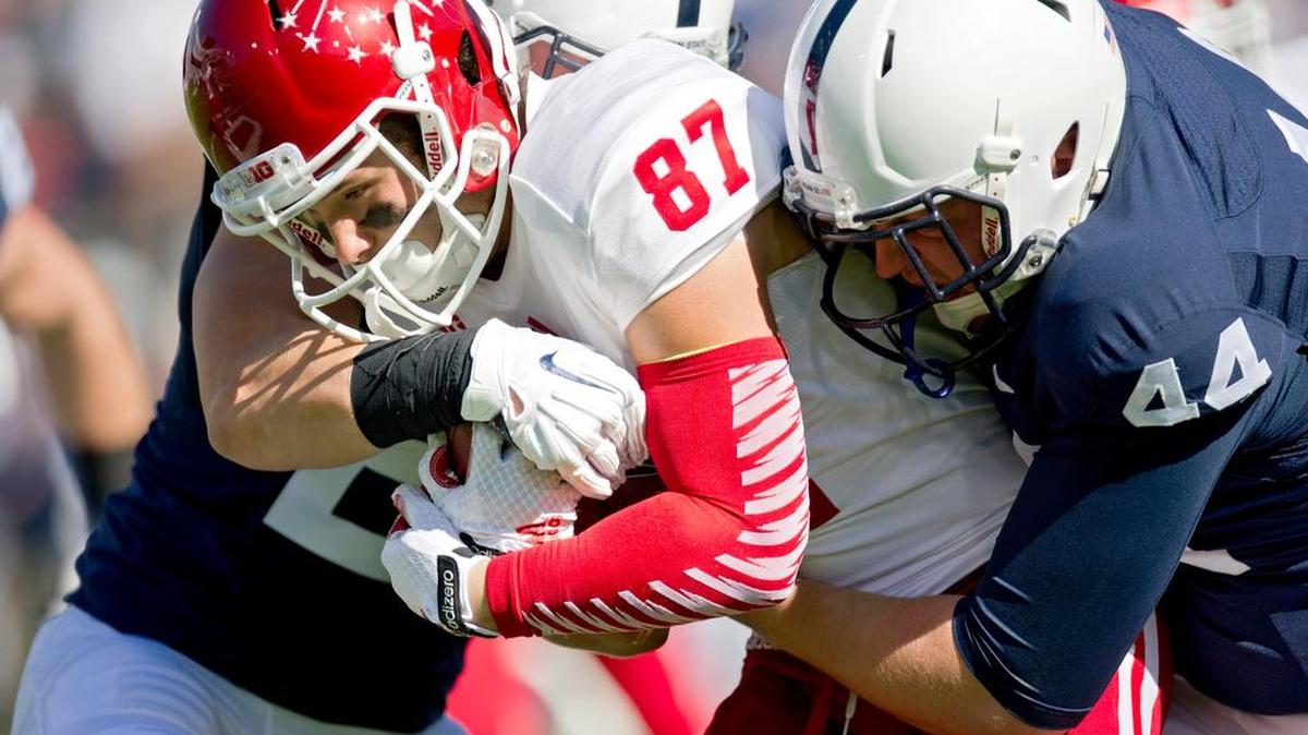 Penn State Ty Yazujian pulls down Indiana wide receiver Mitchell Paige last year at Beaver Stadium. Yazujian, a senior, has been a consistent long snapper, adjusting to several kicker and punter rotations, for the past three seasons.