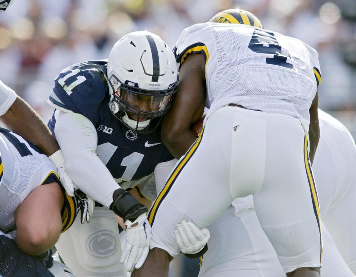 Penn State linebacker Brandon Bell stops Michigan ball carrier De’Veon Smith during the Saturday, November 21, 2015 football game at Beaver Stadium. Michigan won, 28-16.