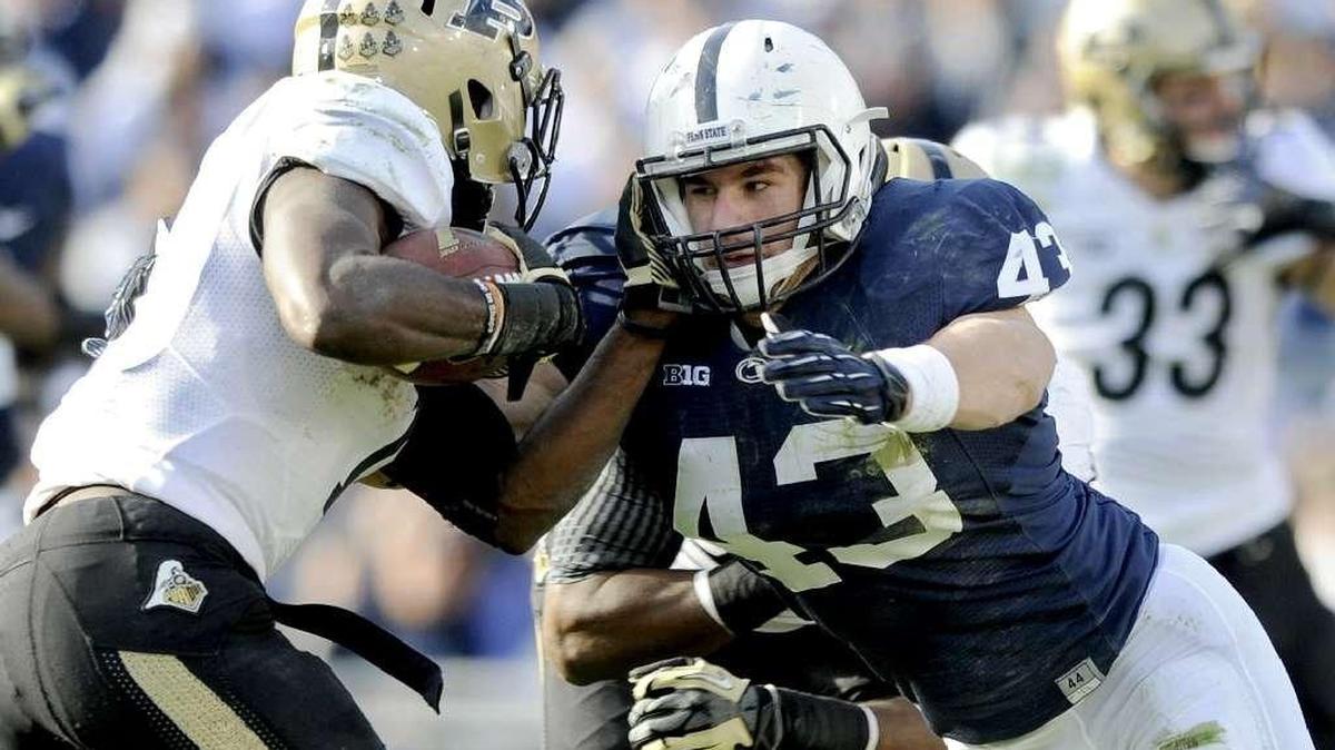 Penn State linebacker Mike Hull tackles a Purdue ball carrier.