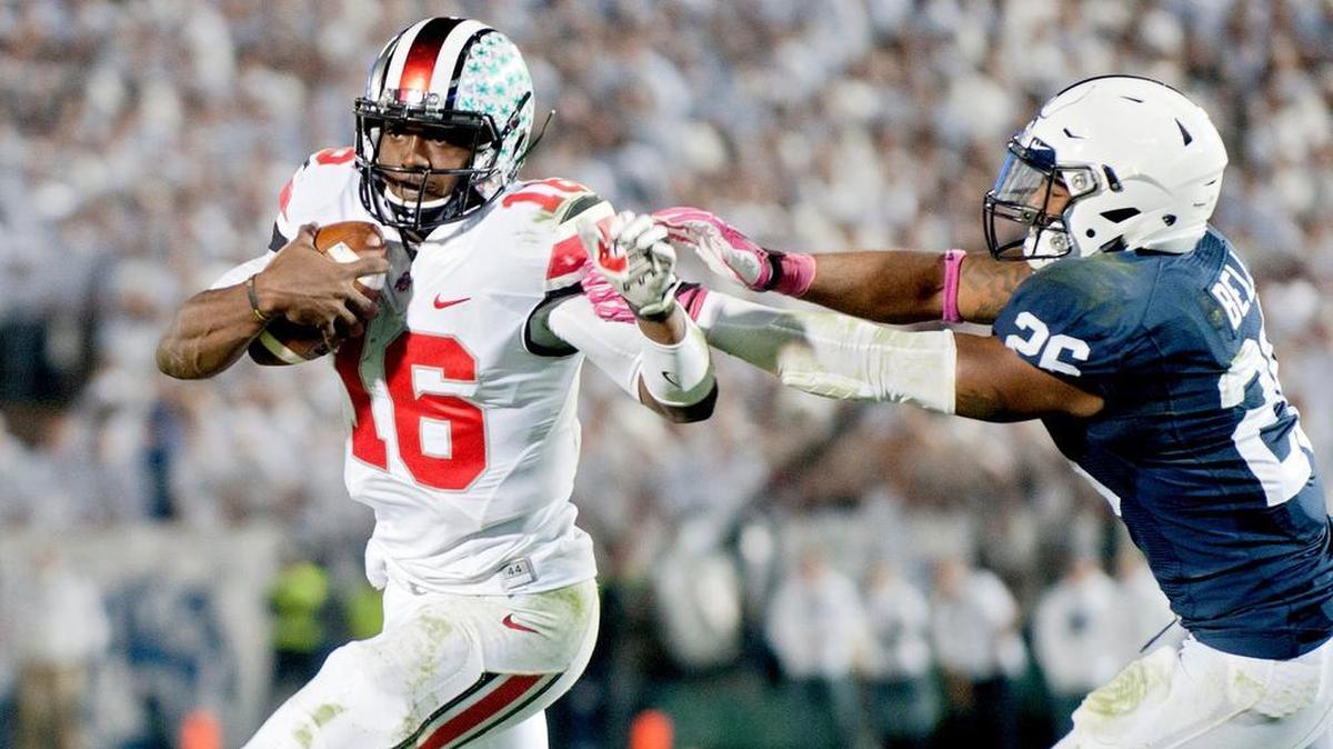 Penn State’s Brandon Bell tries to pull down Ohio State's J.T. Barrett during overtime of the Saturday, October 25, 2014 game at Beaver Stadium. Ohio State won in second overtime, 31-24.