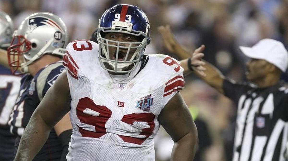 Defensive tackle Jay Alford of the New York Giants reacts after he sacks quarterback Tom Brady of the New England Patriots on second-and-10 in the final minute during Super Bowl XLII on February 3, 2008, at the University of Phoenix Stadium in Glendale, Ariz.