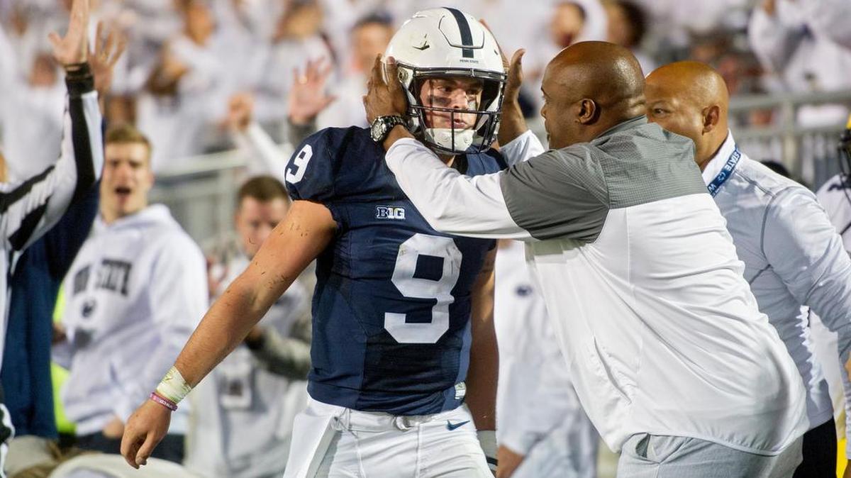 Penn State letterman Ki-Jana Carter congratulates Penn State quarterback Trace McSorley after a touchdown during the Nittany Lions’ 42-13 rout of Michigan. McSorley was named the Davey O’Brien National Quarterback of the Week on Tuesday.