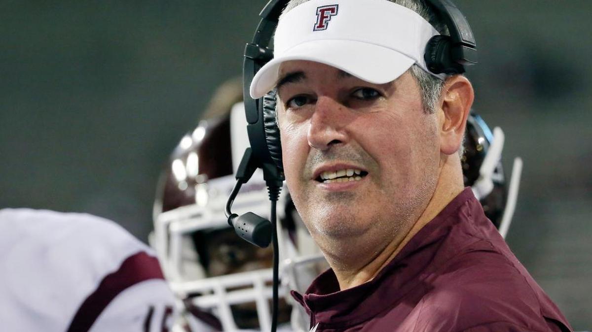 Fordham coach Joe Moorhead talks to players during a timeout in the second half of an NCAA college football game against Army on Friday, Sept. 4, 2015, in West Point, N.Y. Fordham won 37-35.