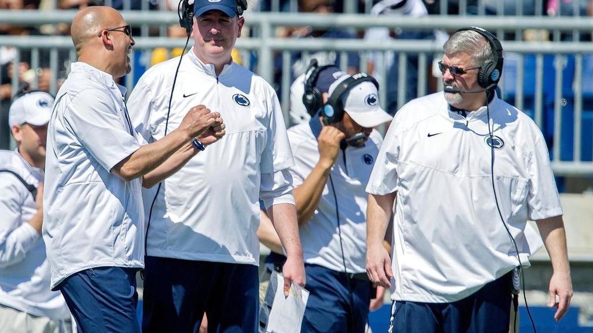 Penn State football coach James Franklin talks with offensive coordinator Joe Moorhead and offensive line coach Matt Limegrover during the Blue-White game on Saturday, April 16, 2016 at Beaver Stadium.