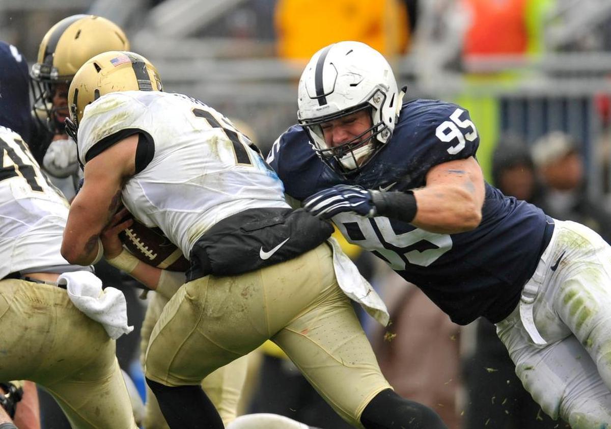 Penn State’s Carl Nassib tackles Army quarterback A.J. Schurr for a loss. Penn State beat Army West Point 20-14 at Beaver Stadium October 3, 2015.