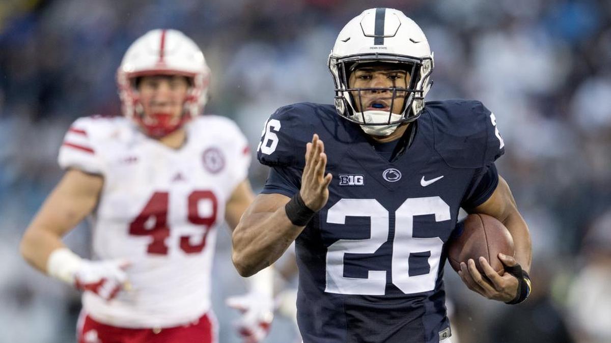 Penn State running back Saquon Barkley runs 65 yards for a touchdown ahead of Nebraska defenders.