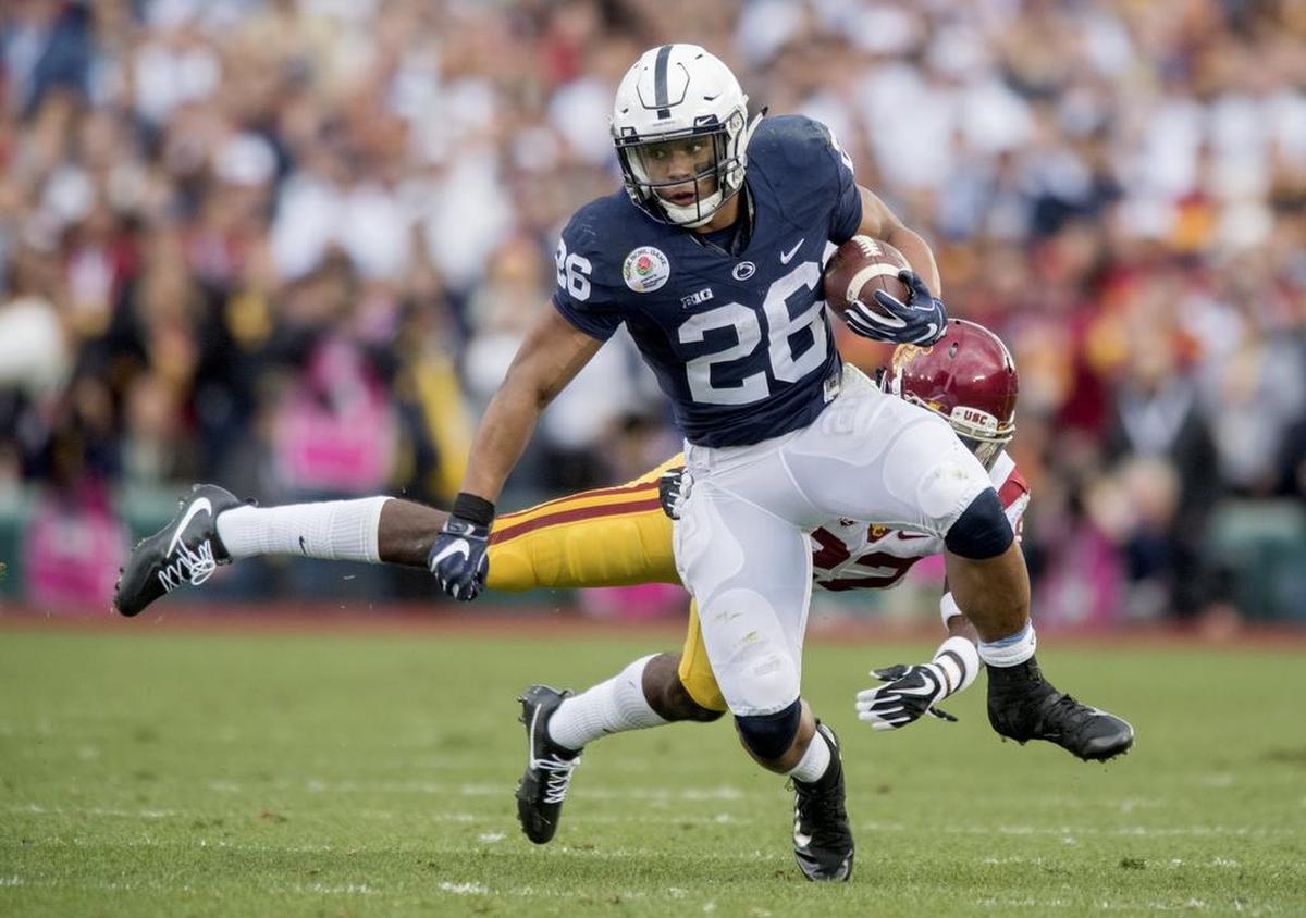 USC tailback Justin Davis can’t stop Penn State running back Saquon Barkley as he darts down the field with the ball during the 2017 Rose Bowl on Monday, January 2, 2017.  