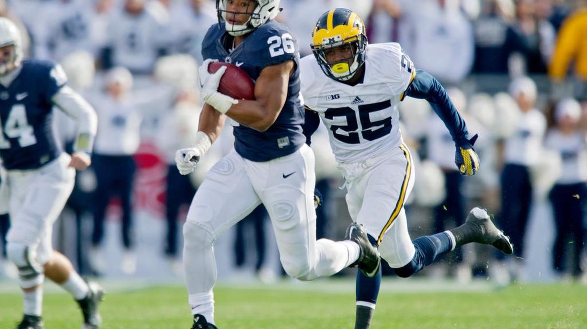 Saquon Barkley picks up yards against Michigan on Saturday.