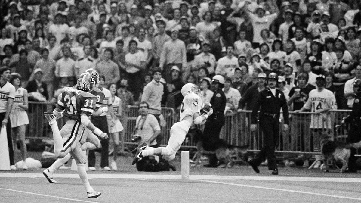 Penn State?s Gregg Garrity (19) catches a 47 yard pass to score a touchdown against Georgia in the Sugar Bowl, Saturday, Jan. 1, 1983 in New Orleans. Penn State won the game and the national championship with a score of 27 to 23. (AP Photo)