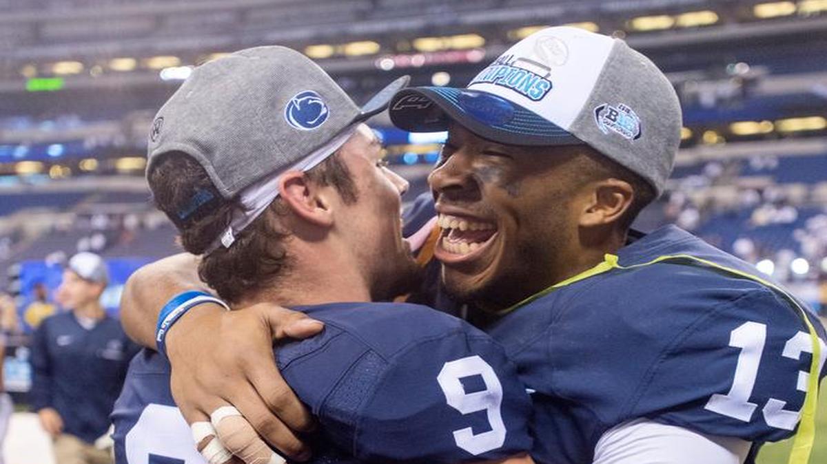 Penn State quarterback Trace McSorley hugs wide receiver Saeed Blacknall after the 38-31 win over Wisconsin to become the 2016 Big Ten Champions at Lucas Oil Stadium on Dec. 3, 2016.