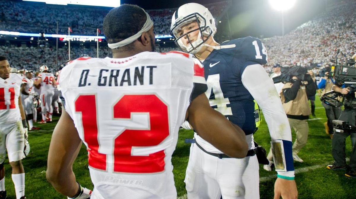 Ohio State’s Grant Doran talks to Penn State’s Christian Hackenberg after the Buckeyes just slipped past Penn State, 31-24 in double-overtime on Oct. 25, 2014. The loss showed that Penn State was a resilient bunch early in James Franklin’s tenure — and that would go on to be a recurring theme.
