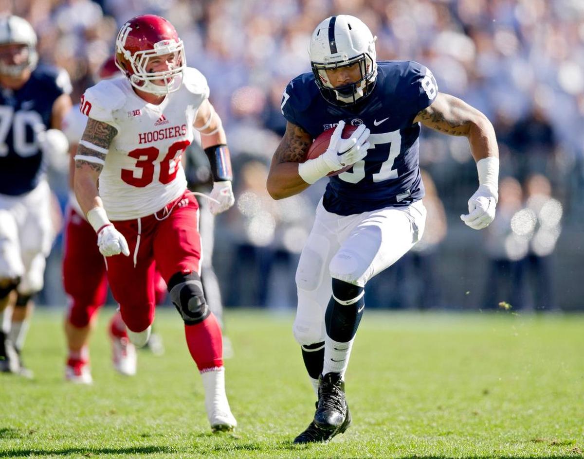 Penn State tight end Kyle Carter runs down the field with the ball from Indiana safety Chase Dutra during the Saturday, October 10, 2015 game at Beaver Stadium. Penn State won, 29-7.