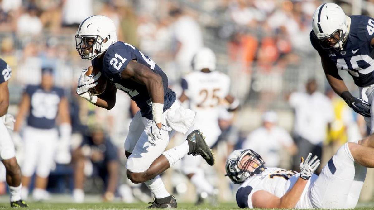 Penn State cornerback Amani Oruwariye intercepts the ball and runs it in for a touchdown during the Saturday, September 3, 2016 game in Beaver Stadium. The Nittany Lions got the first win of the season, 33-13, over Kent State.